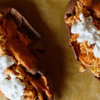 Instant Pot Buffalo Chicken is delicious on top of baked sweet potatoes with yogurt blue cheese dressing.