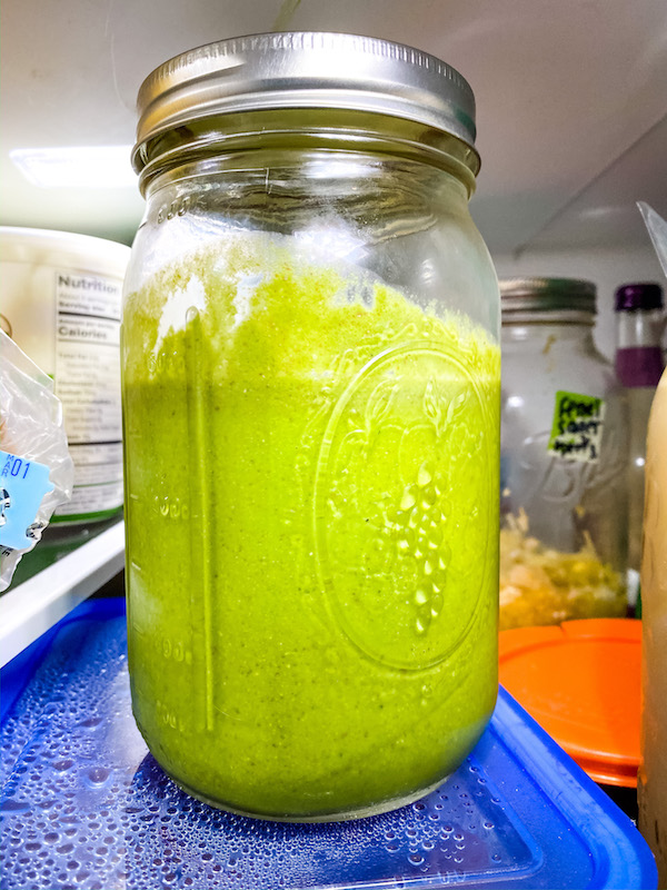 Photo of green smoothie for kids stored in a large mason jar